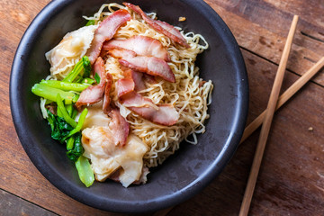 Traditional Thai egg noodles on wooden table top