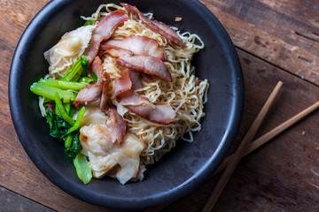 Traditional Thai egg noodles on wooden table top