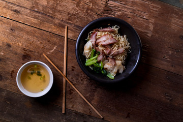 Traditional Thai egg noodles on wooden table top
