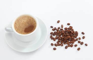 cup of coffee with beans on white background