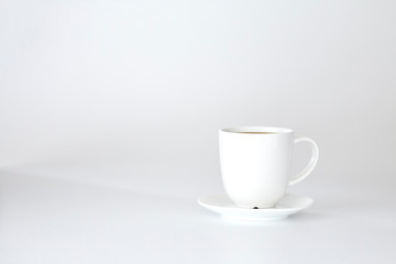 Empty white cup isolated on white