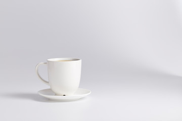 Empty white cup isolated on white