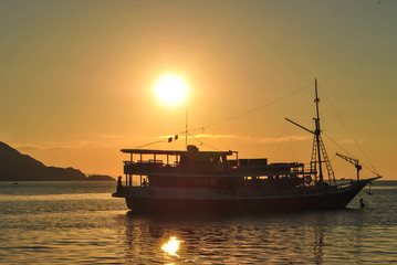 Sailing boat on the sea at sunset. Beautiful Sunset in tropical Komodo island, Labuan Bajo, Fores, Indonesia
