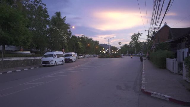 asan traffic late in the afternoon with a scooter passing by