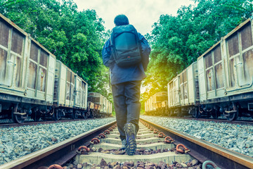 Pathway to success concept a man walk on the railroad  go to the light at the destination  with space area for write some text on background meaning walk to success concept