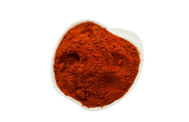 Spice in a plate on isolate. Seasoning in a ceramic plate on an isolated surface.