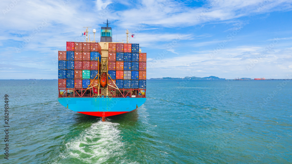 Wall mural container ship leaving the industrial port, import and export business logistic and transportation o