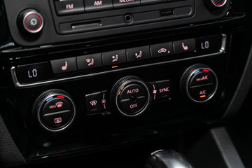 Close up car ventilation system and air conditioning - details and controls of modern car..