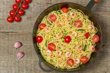 Pasta with shrimp and vegetables. The view from the top. Copy space.