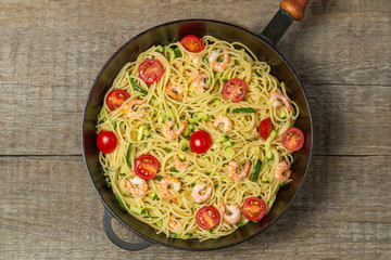 Pasta with shrimp and vegetables. The view from the top. Copy space.