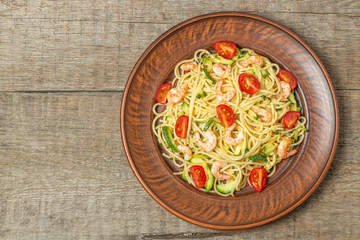 Pasta with shrimp and vegetables. The view from the top. Copy space.