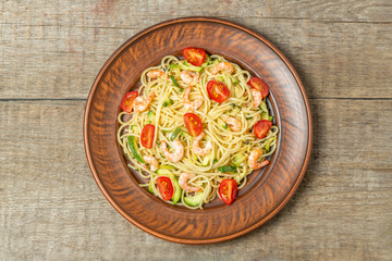 Pasta with shrimp and vegetables. The view from the top. Copy space.