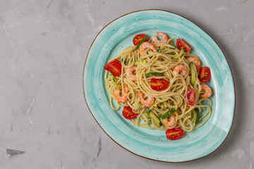 Pasta with shrimp and vegetables. The view from the top. Copy space.