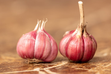 Garlic in the heads on the marble table