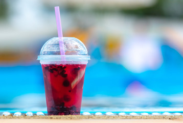 Red cocktail by the pool