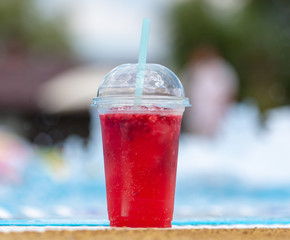 Red cocktail by the pool