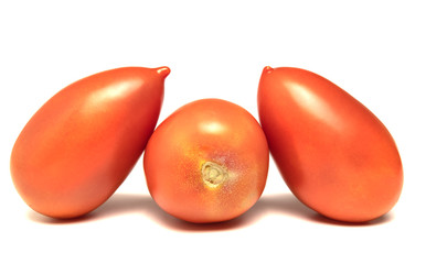  red tomatoes lie in a row on a white background