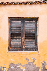 Windows with green wooden shutters