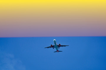 Fototapeta na wymiar airplane in the air the sunset