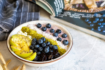 Breakfast in a bowl with berries and honey