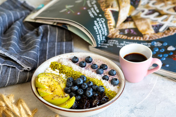 Breakfast in a bowl with berries and honey