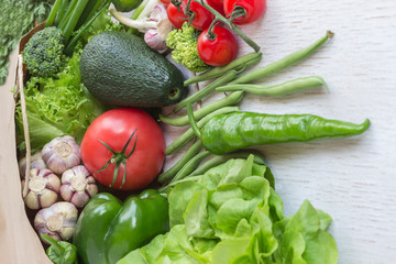 Healthy food in paper bag of different  vegetables on white background. Top view.