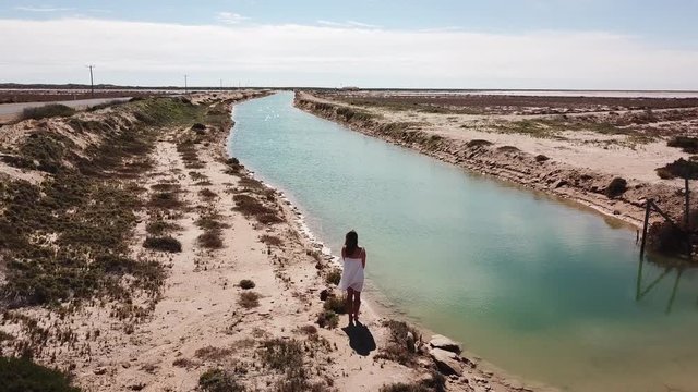 Aerial of woman and vast desert salt lake in Western Australia
