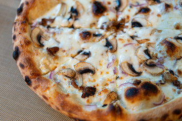 Mushroom pizza on a plate in restaurant