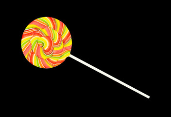 Colorful spiral lollipop on black background with clipping path