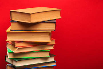  pile of old books, panorma, good copy space  on red background