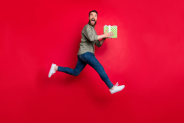 Full length body size photo of rejoicing man wearing jeans denim having received gift at lottery...