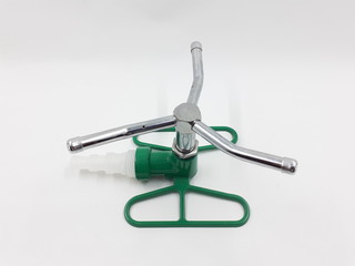 Green Silver Colored Metallic Rotary Sprinkler Parts and Components for Gardening Yard in White Isolated Background