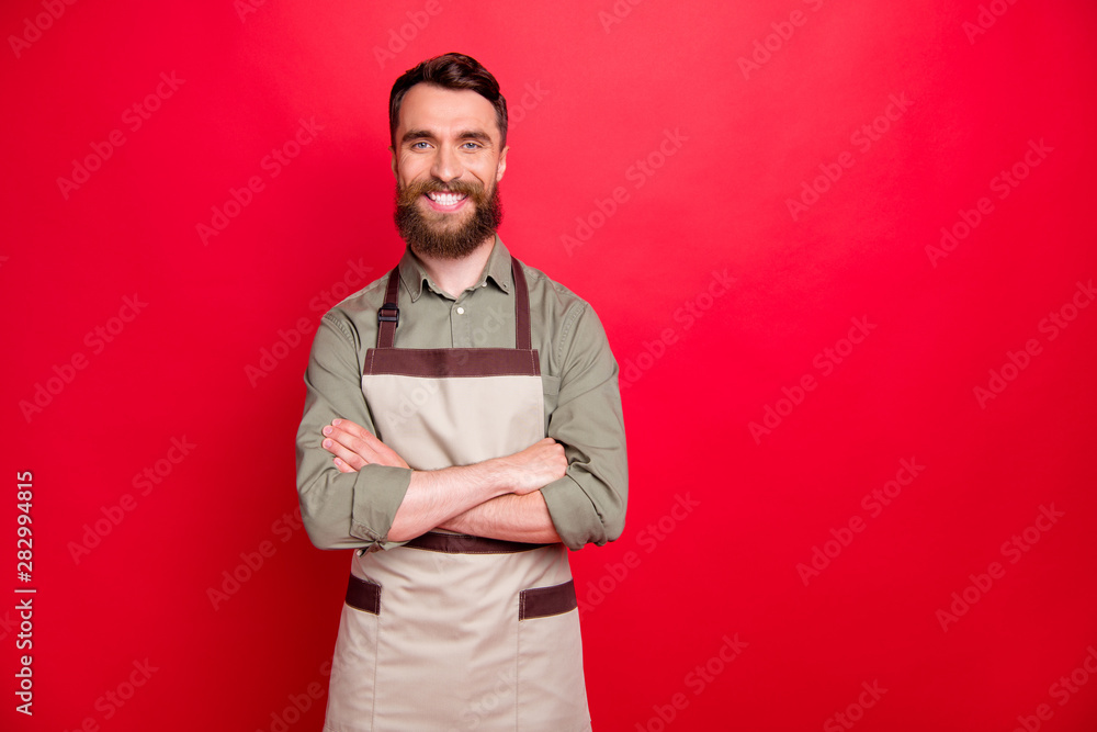 Wall mural Portrait of his he nice attractive cheerful cheery content bearded guy restaurant fast food owner folded arms isolated over bright vivid shine red background