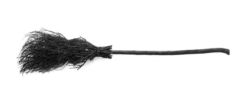 black halloween witch's broom on a white background