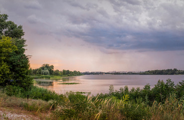 Fototapeta na wymiar Warm summer evening over the Dnieper River in Eastern Europe, Ukraine