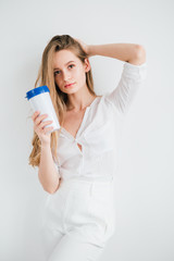 Girl holding a useful reusable glass for comparison