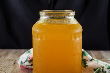sweet honey in a jar on a wooden background