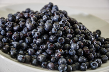 tasty blueberries in a plate. Close-up.