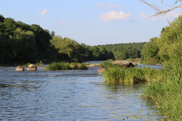 Small rapids on flat rivers attract tourists and travelers in the summer