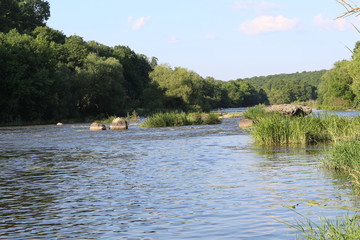 Small rapids on flat rivers attract tourists and travelers in the summer