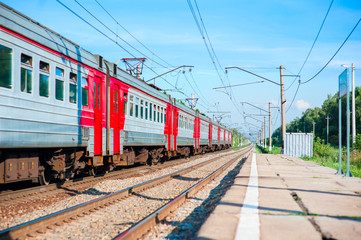 Fototapeta premium Electric train pulls up to the station platform