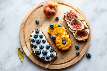 Obraz na płótnie Canvas Bruschetta with berries Board Healthy breakfast Vegetarian food