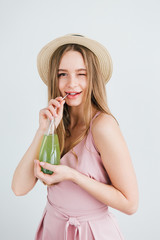 Girl drinks a healthy green drink with Basil seeds