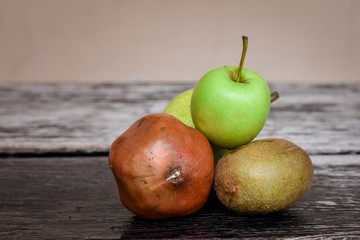 Fruits lying on the wooden table.