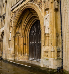 A close up of the grand entrance, and large wooden doors, to the Cathedral