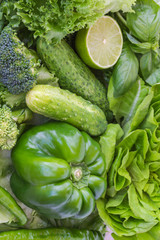 Healthy green vegetables: broccoli and cucumbers, lettuce, onions and peppers