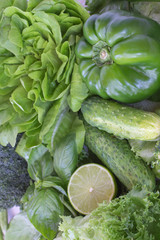 Healthy green vegetables: broccoli and cucumbers, lettuce, onions and peppers