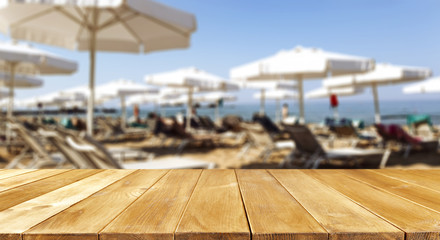 desk of free space and beach background 