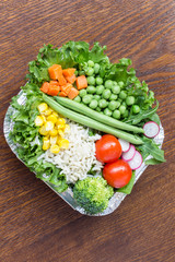 A set of vegetables with rice for a healthy diet: corn, peas, asparagus, carrots, broccoli, lettuce
