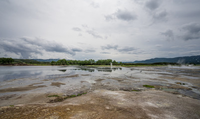 Hot water lake and mud field in Uzon caldera. Kronotsky Nature Reserve in Russian far east,...
